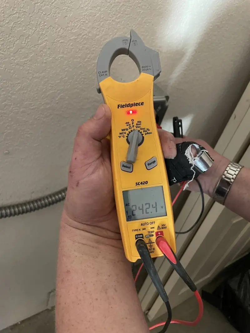 Voltage testing with clamp meter during Electrical Installation Services in Constantine